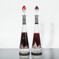 Lot 350 - PAIR OF GEORGE V SILVER COLLARED CRANBERRY...