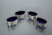 Lot 377 - SET OF FOUR EDWARDIAN SILVER SALT CELLARS...
