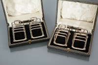 Lot 386 - SET OF FOUR GEORGE V SILVER TOAST RACKS...