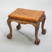 Lot 1019 - EARLY 20TH CENTURY WALNUT STOOL with a studded...