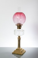 Lot 1183 - VICTORIAN BRASS OIL LAMP WITH CRANBERRY GLASS...