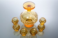 Lot 513 - AMBER TINTED GLASS LIQUEUR SET comprising an...