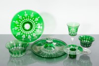 Lot 553 - SUITE OF GREEN FLASHED TABLE GLASS the part...