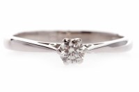 Lot 584 - DIAMOND SOLITAIRE RING set with a round...