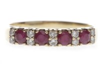 Lot 742 - NINE CARAT GOLD RUBY AND DIAMOND RING set with...