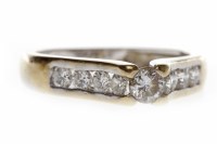 Lot 744 - DIAMOND DRESS RING set with a central round...