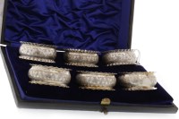 Lot 860 - COMPOSITE SET OF SIX SILVER NAPKIN RINGS three...