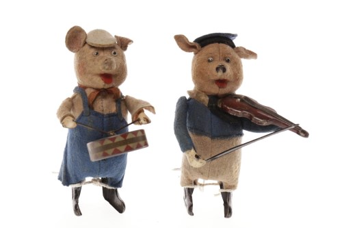 Lot 1620 - TWO SCHUCO CLOCKWORK MUSICAL PIGS with felt...