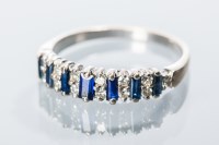 Lot 1648 - SAPPHIRE AND DIAMOND RING set with seven...