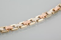 Lot 1672 - GOLD TRI COLOUR BRACELET with white, yellow...