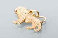 Lot 1677 - EIGHTEEN CARAT GOLD LION MOTIF PENDANT...