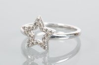 Lot 1692 - STAR MOTIF DIAMOND CLUSTER RING the star...