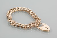 Lot 1698 - NINE CARAT GOLD CURB LINK BRACELET the padlock...