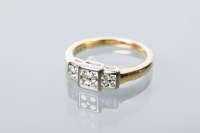 Lot 1712 - DIAMOND CLUSTER RING set with three square...