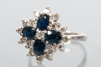 Lot 1718 - SAPPHIRE AND DIAMOND CLUSTER RING set with...