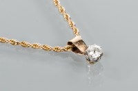 Lot 1784 - DIAMOND SOLITAIRE PENDANT the brilliant cut...