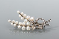 Lot 1795 - MIKIMOTO PEARL BROOCH of scrolling foliate...