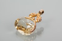 Lot 1815 - NINE CARAT GOLD CITRINE FOB of ornate...