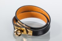 Lot 1825 - HERMES LEATHER BRACELET in black leather, the...