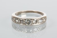 Lot 1843 - DIAMOND HALF ETERNITY RING the brilliant cut...