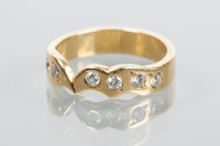 Lot 1852 - UNUSUAL DIAMOND SET BAND of scalloped design,...