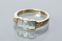 Lot 1857 - AQUAMARINE THREE STONE RING set with three...