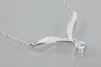 Lot 1860 - AQUAMARINE AND DIAMOND PENDANT with a pear cut...