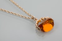 Lot 1869 - ORANGE GEM SET FOB with a faceted orange stone...