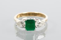 Lot 1870 - EMERALD AND DIAMOND THREE STONE RING the...