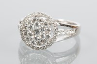 Lot 1871 - DIAMOND CLUSTER RING of circular form, set...