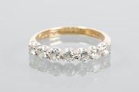 Lot 1872 - DIAMOND HALF ETERNITY RING set with a row of...