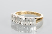 Lot 1877 - DIAMOND SIX STONE RING set with a row of six...