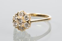 Lot 1878 - DIAMOND CLUSTER RING of flower form, set with...