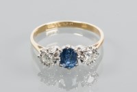 Lot 1879 - SAPPHIRE AND DIAMOND THREE STONE RING set with...