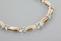 Lot 1884 - EMERALD AND DIAMOND BI-COLOUR BRACELET with...