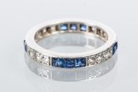 Lot 1888 - ART DECO DIAMOND AND SAPPHIRE ETERNITY RING...