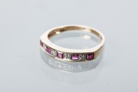 Lot 1906 - RUBY AND DIAMOND HALF ETERNITY RING set with...