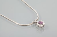 Lot 1915 - RUBY AND DIAMOND CLUSTER PENDANT NECKLACE the...