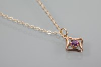 Lot 1926 - AMETHYST PENDANT with a central brilliant cut...