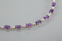 Lot 1938 - AMETHYST AND DIAMOND BRACELET set with oval...