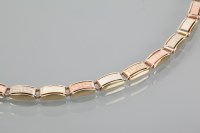 Lot 1952 - BI COLOUR GOLD BRACELET with alternating...