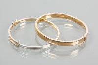 Lot 1957 - TWO GOLD BANGLES one a fourteen carat gold bi...