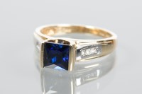 Lot 1975 - SAPPHIRE AND DIAMOND RING with a central...