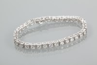 Lot 1981 - DIAMOND TENNIS BRACELET with brilliant cut...