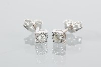 Lot 1984 - PAIR OF DIAMOND STUD EARRINGS each set with a...