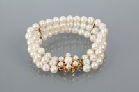 Lot 2007 - TRIPLE STRAND PEARL BRACELET set with...