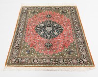 Lot 962 - QUM PART SILK BORDERED RUG decorated with a...
