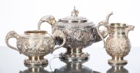 Lot 308 - INDIAN WHITE METAL THREE PIECE TEA SERVICE...