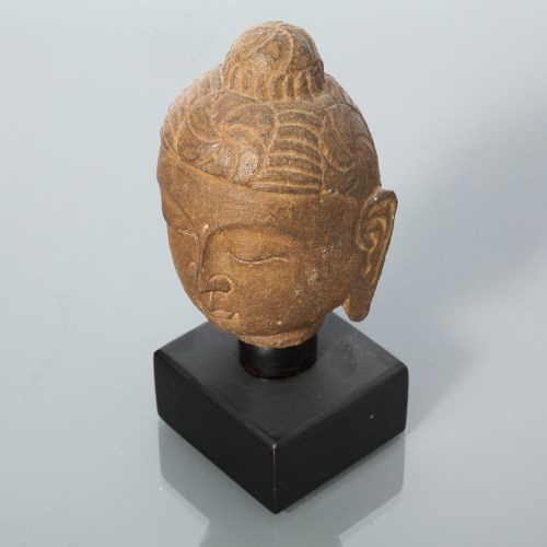 Lot 377 - EASTERN STONE BUDDHA HEAD mounted on a black...