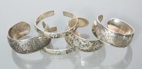 Lot 454 - FIVE CHINESE SILVER BANGLES comprising a pair...